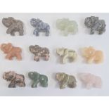 An oriental cased box of twelve hard-stone elephants, to include rose quartz etc