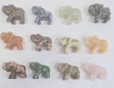 An oriental cased box of twelve hard-stone elephants, to include rose quartz etc