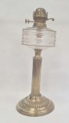 Old brass oil lamp with cut glass drum shaped well on reeded column and gadrooned circular base,