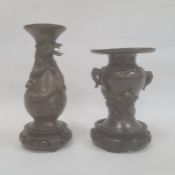 Two Japanese Meiji period bronze vases, the first baluster shaped, 15.5cm high and the second of