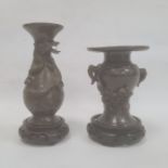 Two Japanese Meiji period bronze vases, the first baluster shaped, 15.5cm high and the second of