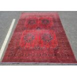 Modern Eastern-style red ground rug with stepped border, 203cm x 195cm