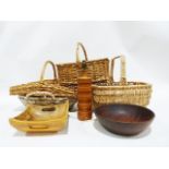 Four assorted wicker baskets, a turned wooden table lamp base and two wooden bowls