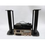Rotel DVD player and a Teac stereo cassette deck and a pair of speaker stands