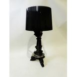 Kartell black plastic table lamp and shade, having tripod scroll base, 76cm high Condition