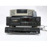 Bose radio alarm clock, a Denon cassette player and a Panasonic VHF player