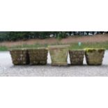 Five square stone-effect jardinieres, the largest with latticework decoration, 36cm wide (5)