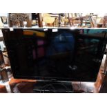 Panasonic flatscreen TV, model no. TX-L32E5B, 32" screen and the remote control