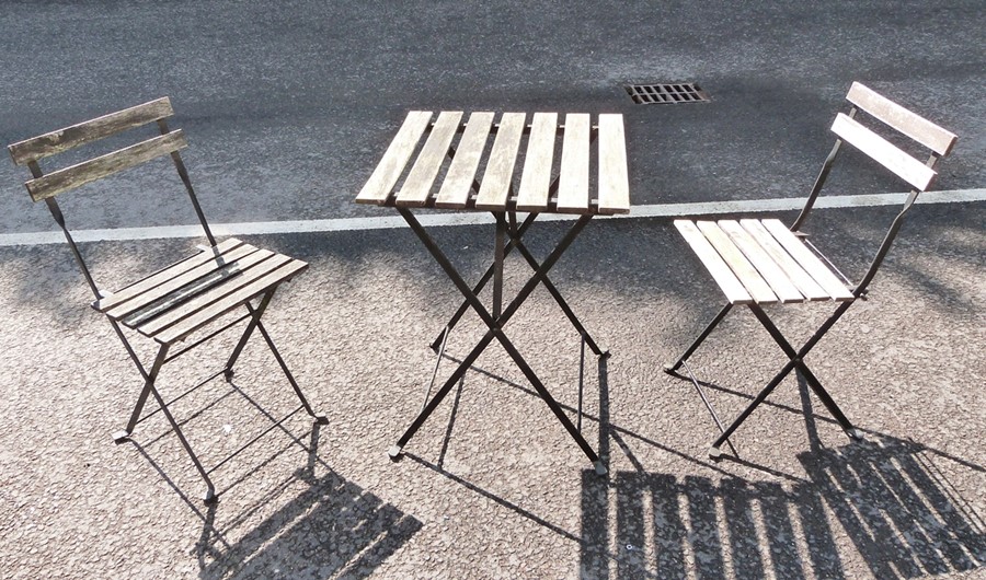 Slatted wood and black metal folding small garden table and pair matching chairs