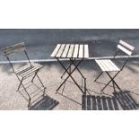 Slatted wood and black metal folding small garden table and pair matching chairs