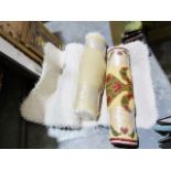 Two white sheepskin-type rugs and another (3)