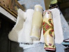 Two white sheepskin-type rugs and another (3)