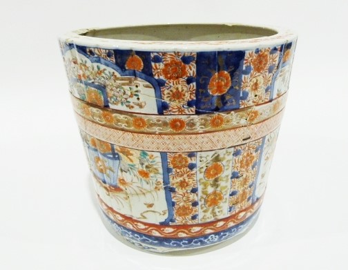 Large Japanese jardinere of barrel design painted in the Imari palette with panels of baskets of