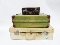 Vintage canvas suitcase with leather corners, the interior fitted for shoes, a second vintage