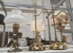 Brass bodied oil lamp with opaque shade and a pair of modern brass desk lamps (3)