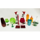 Quantity of coloured glass including a large orange glass goblet, a green glass swan vase, a metal