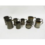 Quantity of pewter mugs, 19th century and later, one with engraved name and another with spout