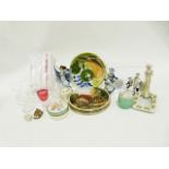 Glass decanter, two wire ceiling light frames, a basket of assorted items, various crockery and
