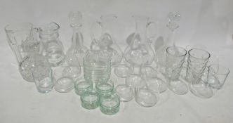 Quantity of assorted glassware to include water jugs, decanters, tumblers, bowls, a set of three