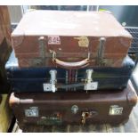 Brown suitcase with Royal Mail London Ltd label (torn), Orlean Paris label and two other