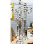 Silver coloured metal decorative floor standing candlelabra, two pairs, 142cm and 101cm (4)