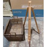 Two large wicker log/paper baskets and an easel