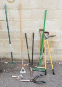 Assorted garden tools  to include a fork, garden rake, yard brush, garden shears, hoe etc.