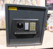 A CE safe electronic system with its code on top of the safe, which measures 38 x 35cm