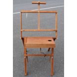 Folding transportable artist's easel with table for palette