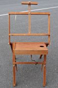 Folding transportable artist's easel with table for palette