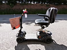 Ableworld motorised battery charged wheelchair with basket and walking stick