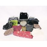 Three boxes of assorted handbags and purses