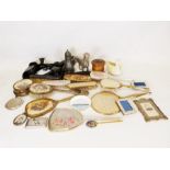 Ebony dressing table set, various brushes and mirrors, metal model gundog etc.