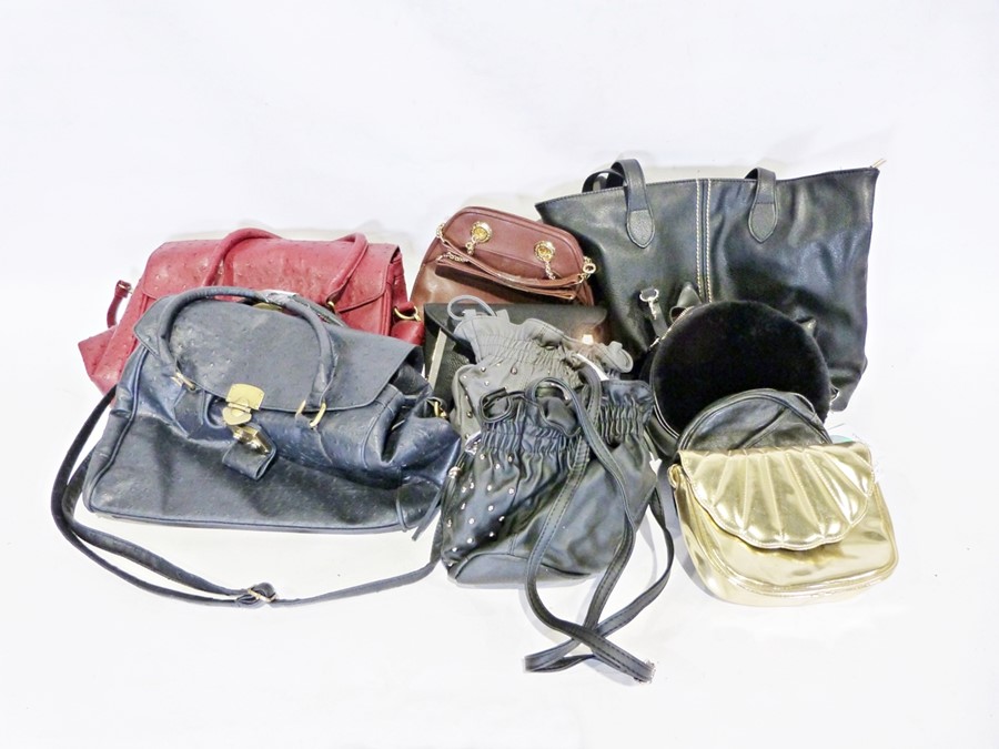 Three boxes of various handbags