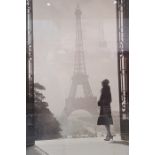 Print of a 1940's view of Paris with woman standing in front of the Eiffel Tower, 89cm x 60cm