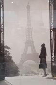Print of a 1940's view of Paris with woman standing in front of the Eiffel Tower, 89cm x 60cm