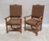 Pair of office reception chairs with oak frames, turned and block supports, stretchered base,