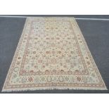 Kelim carpet decorated allover with stylised flowerheads in blue, rust and green, on a cream ground,