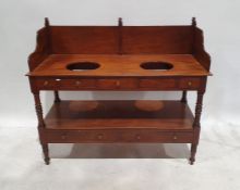 Early 19th century mahogany washstand with three-quarter gallery top, two recesses for basins, above