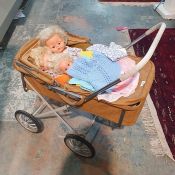 Vintage dolls pram and contents of three composition dolls and assorted dolls clothes and