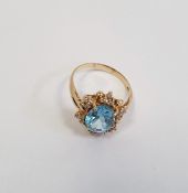 Gold blue topaz and diamond cluster ring, marked 14KT, fingersize Q 1/2, approx. 4g
