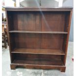 20th century mahogany open bookcase, the rectangular top with moulded edge, Greek key carving,