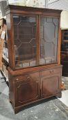 20th century bookcase cabinet with moulded cornice above astragal-glazed doors enclosing shelves,