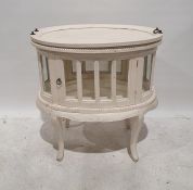 Tray-top display table painted white with lift-out tray, on oval body with glazed door and sides,