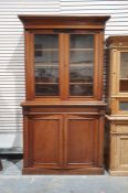 Late 19th century mahogany bookcase cabinet, the moulded cornice above two glazed doors enclosing