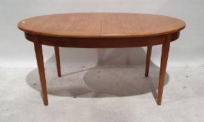 Mid century teak modern extending D-end dining table, on cylindrical tapering bases and legs,