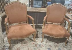 Pair of French oak framed armchairs with carved and moulded frames, upholstered seats, backs and arm