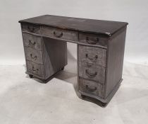 Painted shabby chic style serpentine-fronted desk with nine assorted drawers, on turned feet,