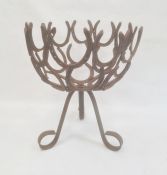 Cast iron / horseshoe formed jardinière stand on three supports