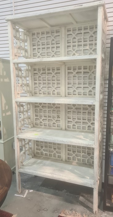 20th century white painted shabby chic style shelving unit in the Oriental taste, carved and pierced